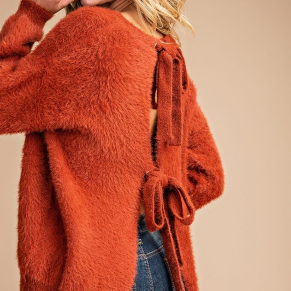 orange sweater with tied back